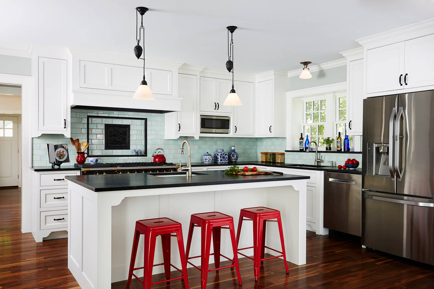 kitchen-with-white-cabinets-and-red-stools