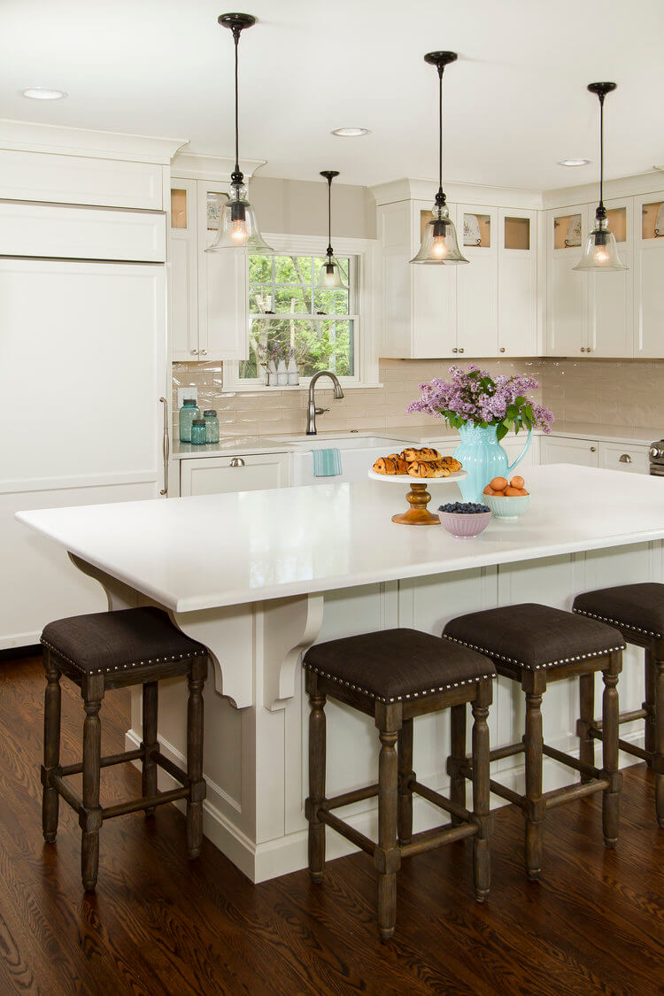 white-kitchen-with-brown-stools